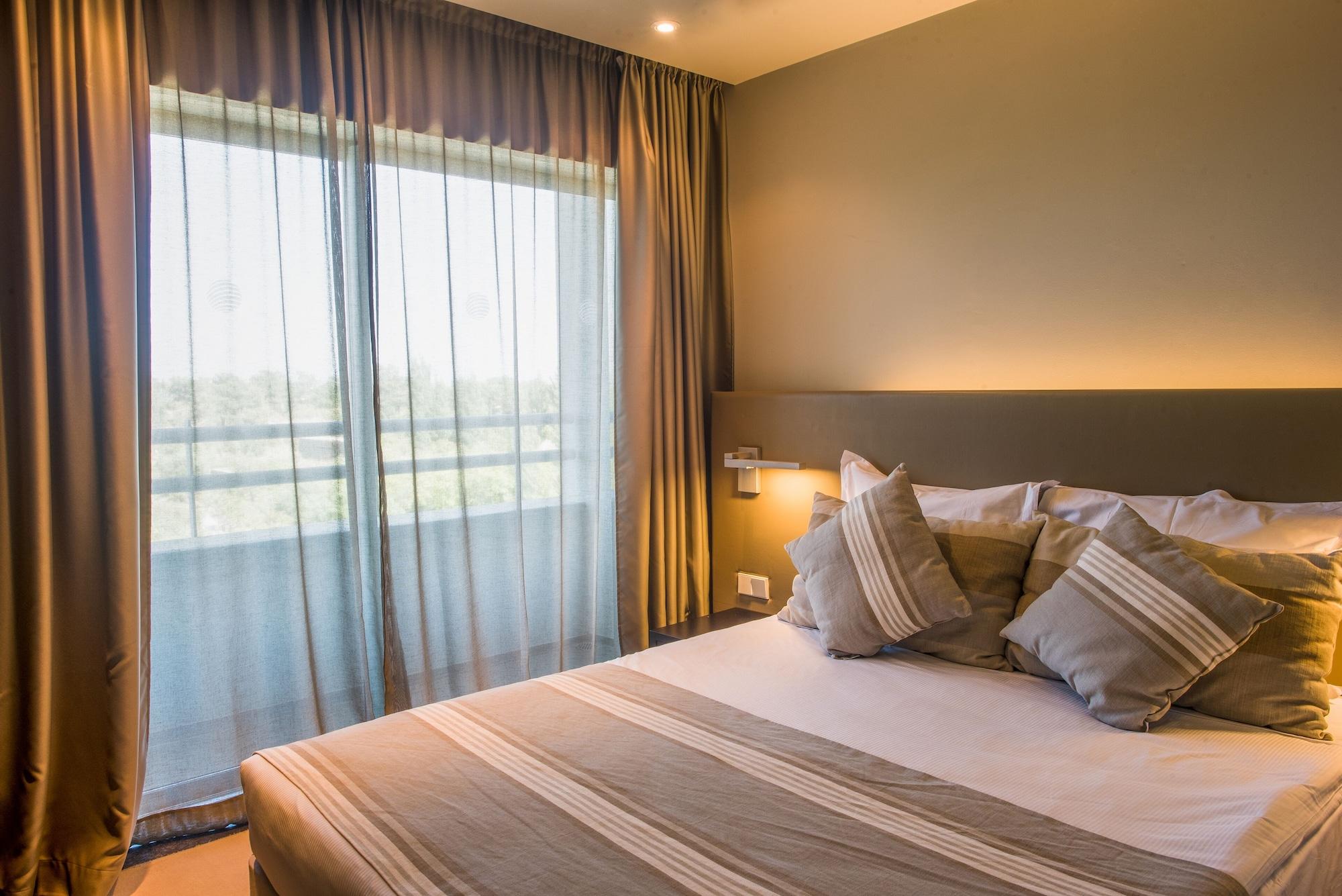 アクアルズ トロイア ラゴア ホテル&アパートメンツ S ホテルズ コレクション エクステリア 写真 A bedroom at the hotel